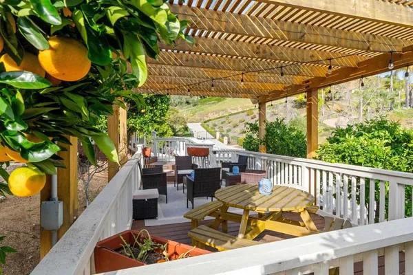 a view of a chairs and table in the patio