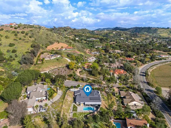 an aerial view of residential houses with outdoor space