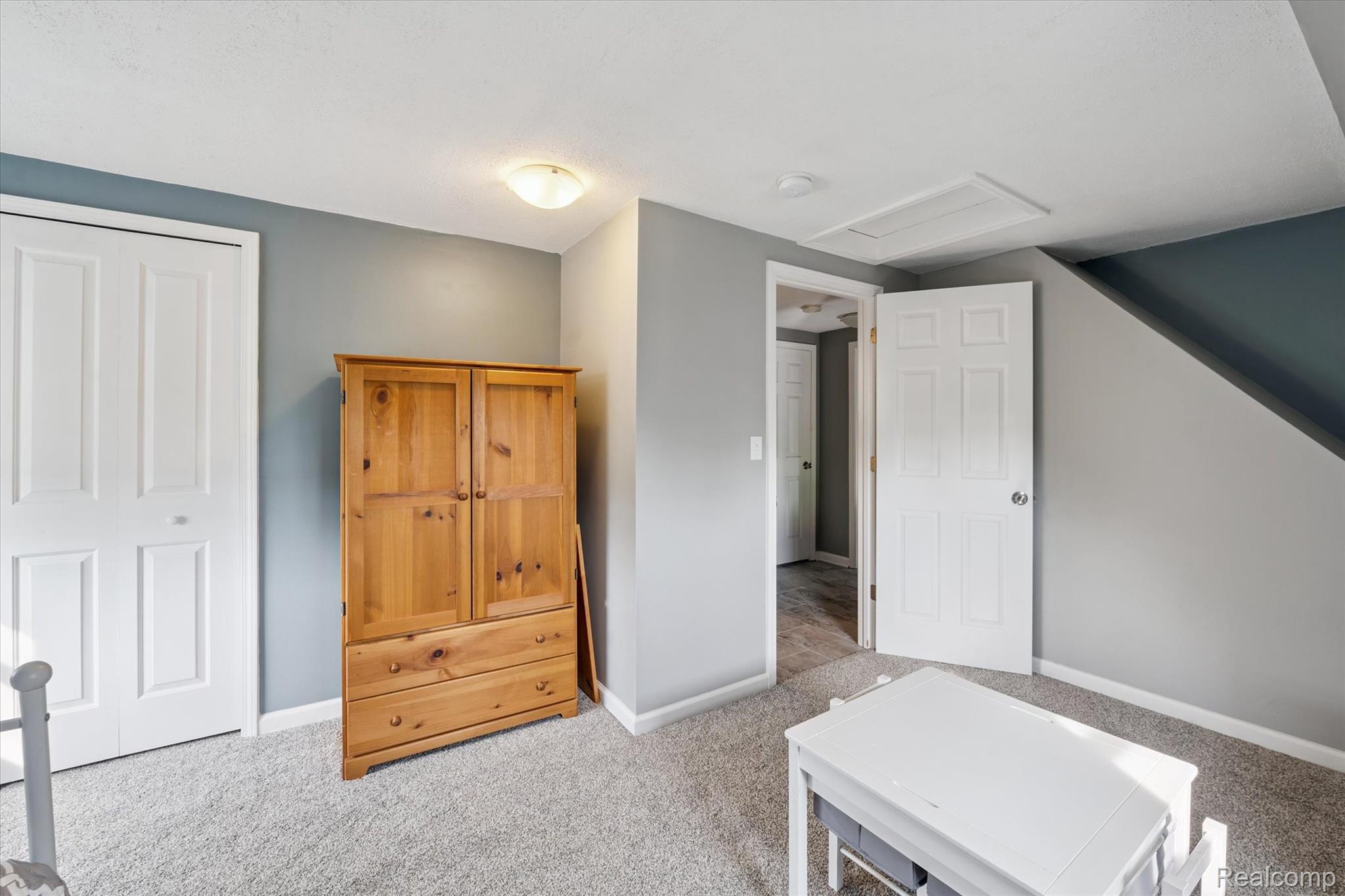 625 Fowlerville Road Fowlerville, MI 48836 - Photo 24 of 55 Bedroom 3 with attic access newer carpet & fresh paint