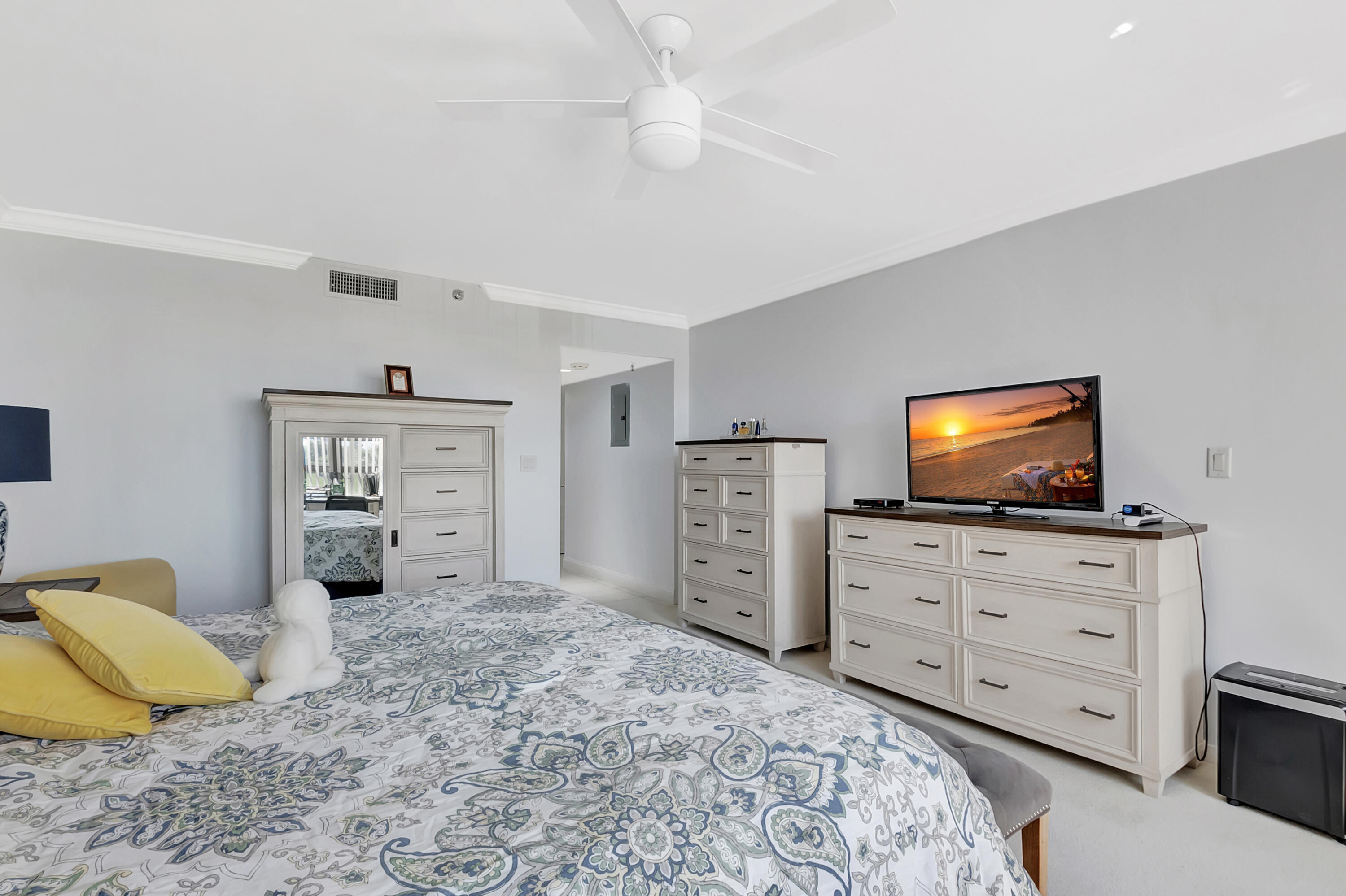 20100 Boca W Drive, Unit 126 Boca Raton, FL 33434 - Photo 19 of 58 a bedroom with a bed and a television