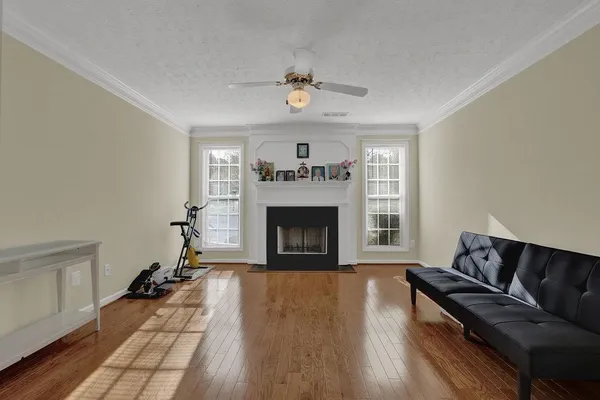a living room with furniture and a fireplace