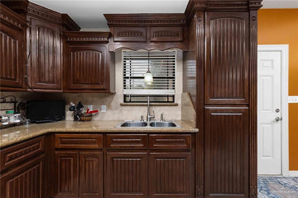 2101 Happy Street Mission, TX 78573 - Photo 6 of 20 a kitchen with sink cabinets and window