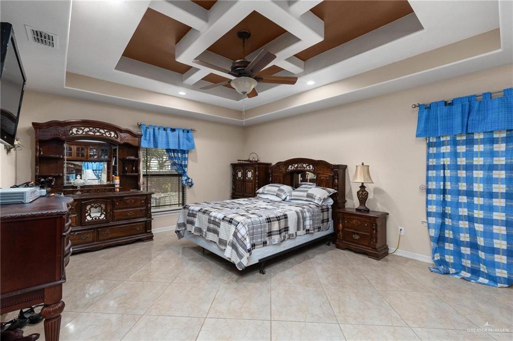 2101 Happy Street Mission, TX 78573 - Photo 10 of 20 a bedroom with a bed and a television