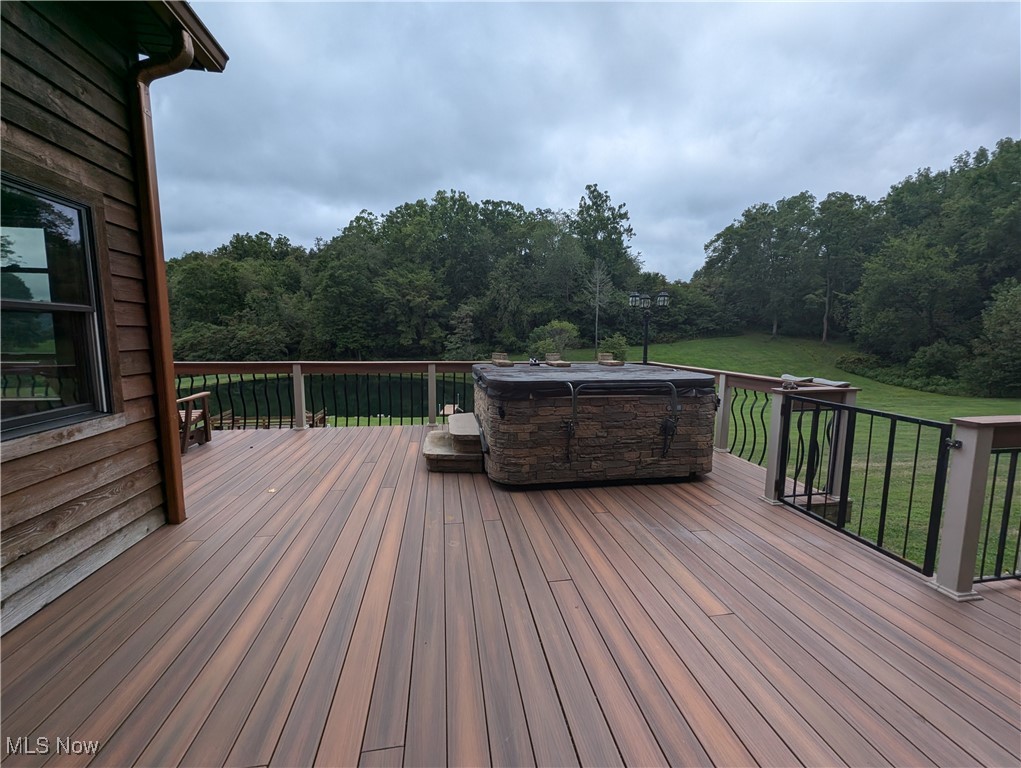 46136 Carlisle Road Lisbon, OH 44432 - Photo 22 of 48 Wooden deck featuring a yard and a hot tub