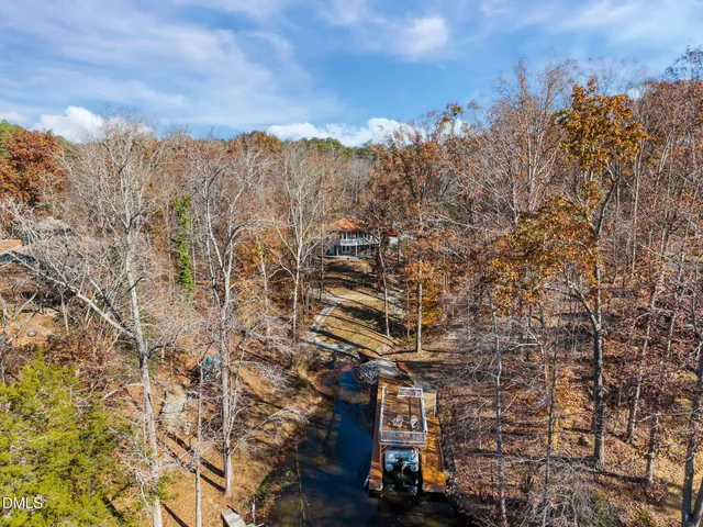 an aerial view of a house with outdoor space