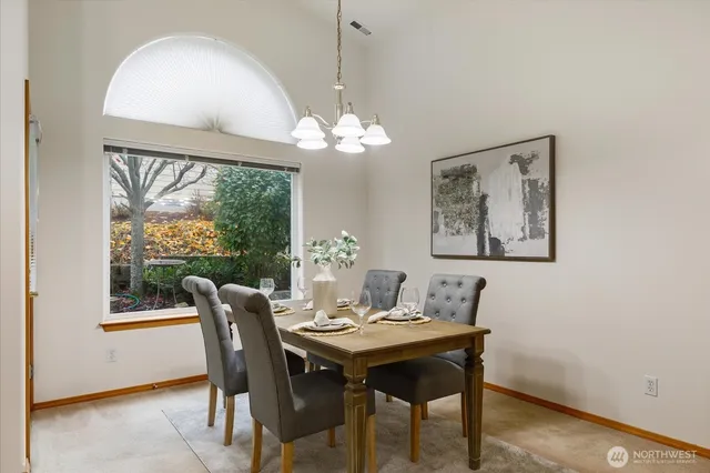 a view of a dining room with furniture window and outside view