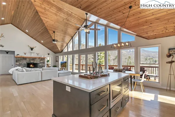 a kitchen with kitchen island granite countertop lots of counter top space and stainless steel appliances