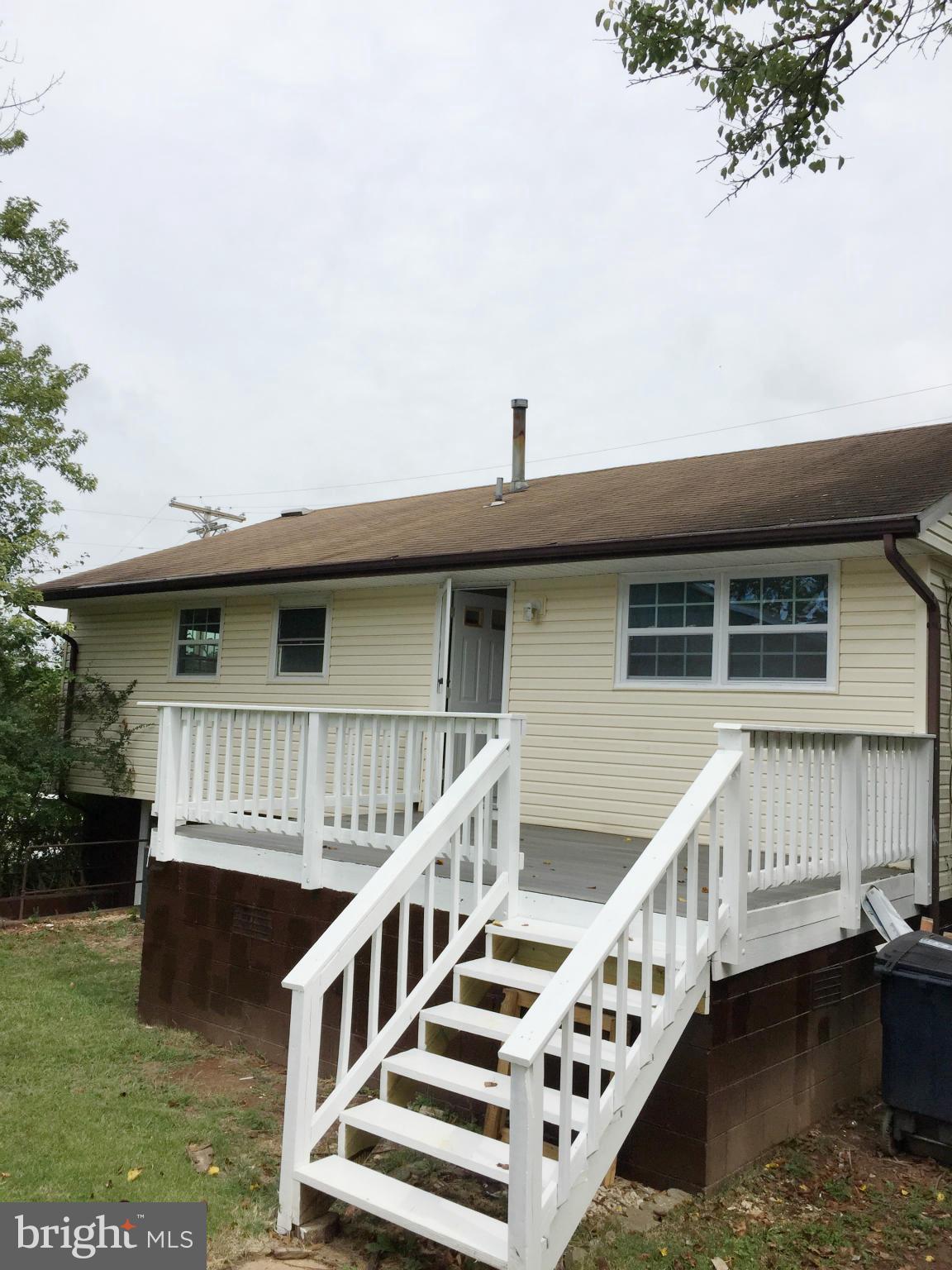 5705 Westgate Road Lanham, MD 20706 - Photo 23 of 26 a view of house with roof deck and deck