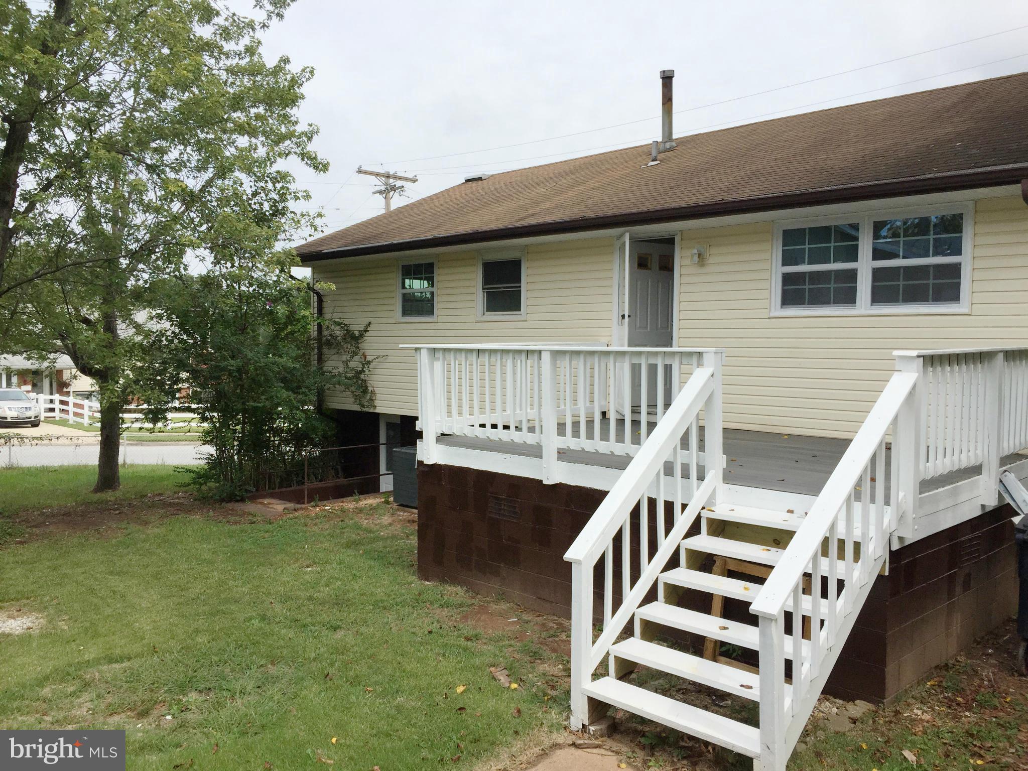 5705 Westgate Road Lanham, MD 20706 - Photo 24 of 26 a view of a house with backyard and deck