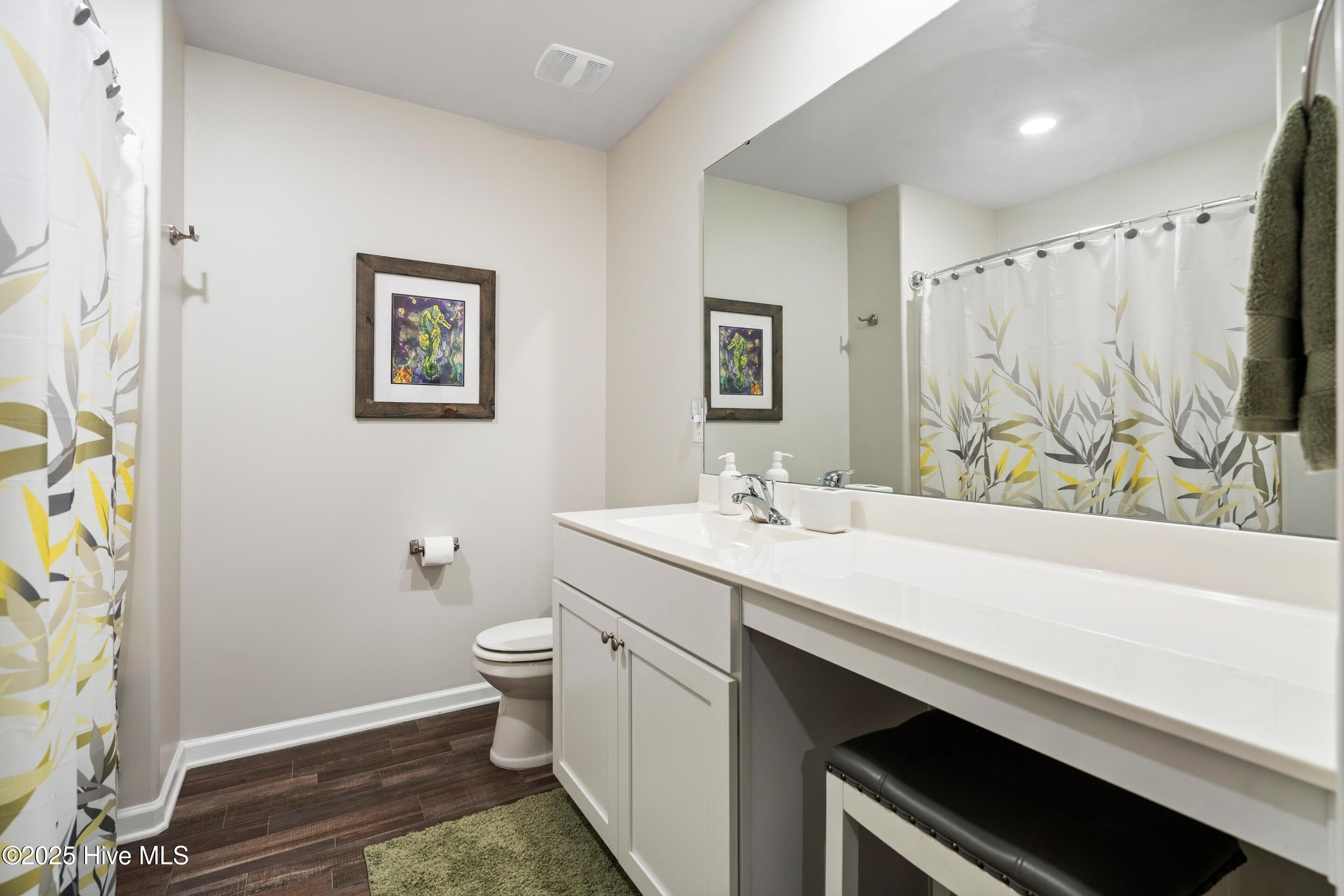 634 Aurora Place Hampstead, NC 28443 - Photo 30 of 51 Full Bath with shower/tub combo and wooden shelves for storage