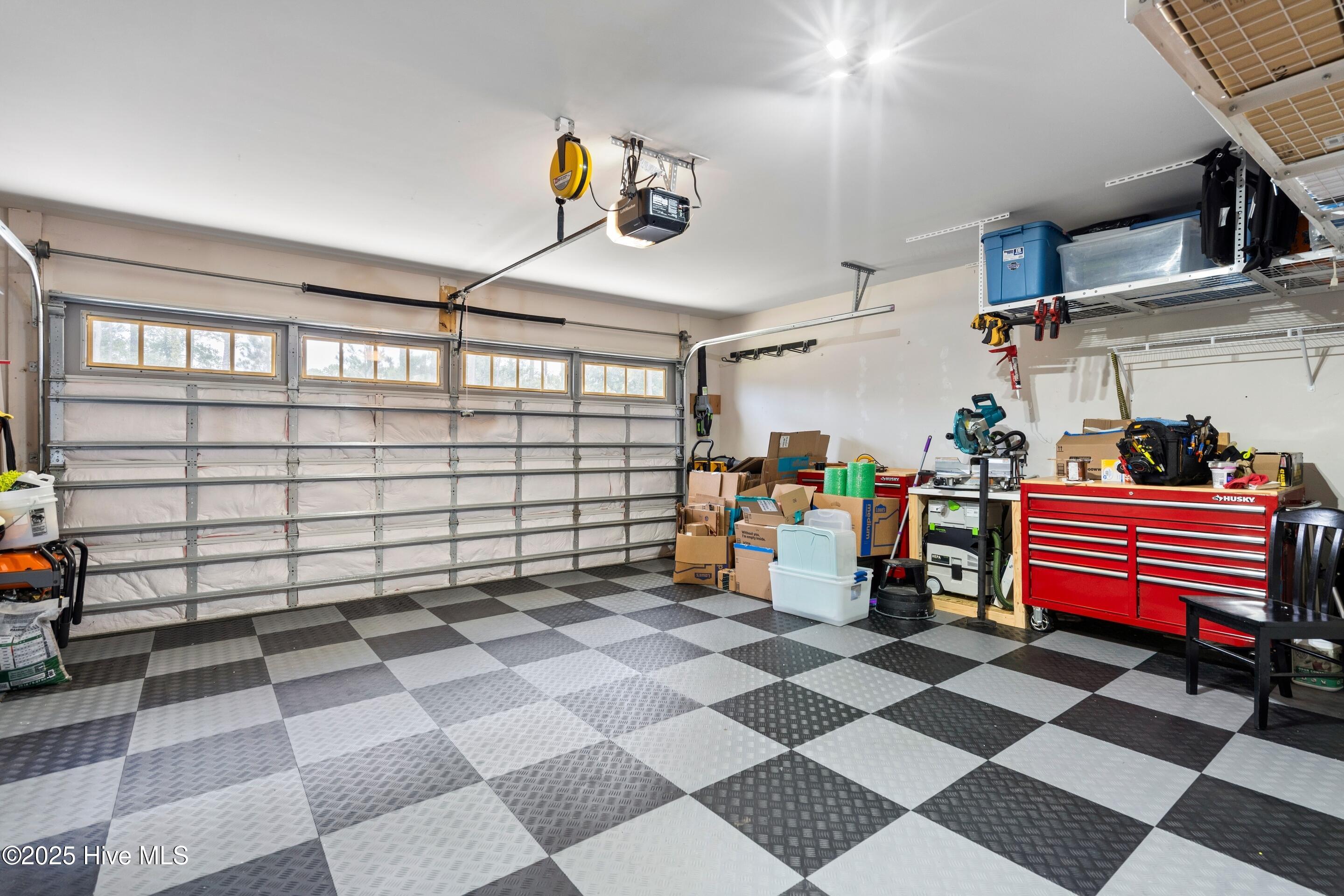 634 Aurora Place Hampstead, NC 28443 - Photo 35 of 51 Flooring, insulated door, mini split and storage in this garage!