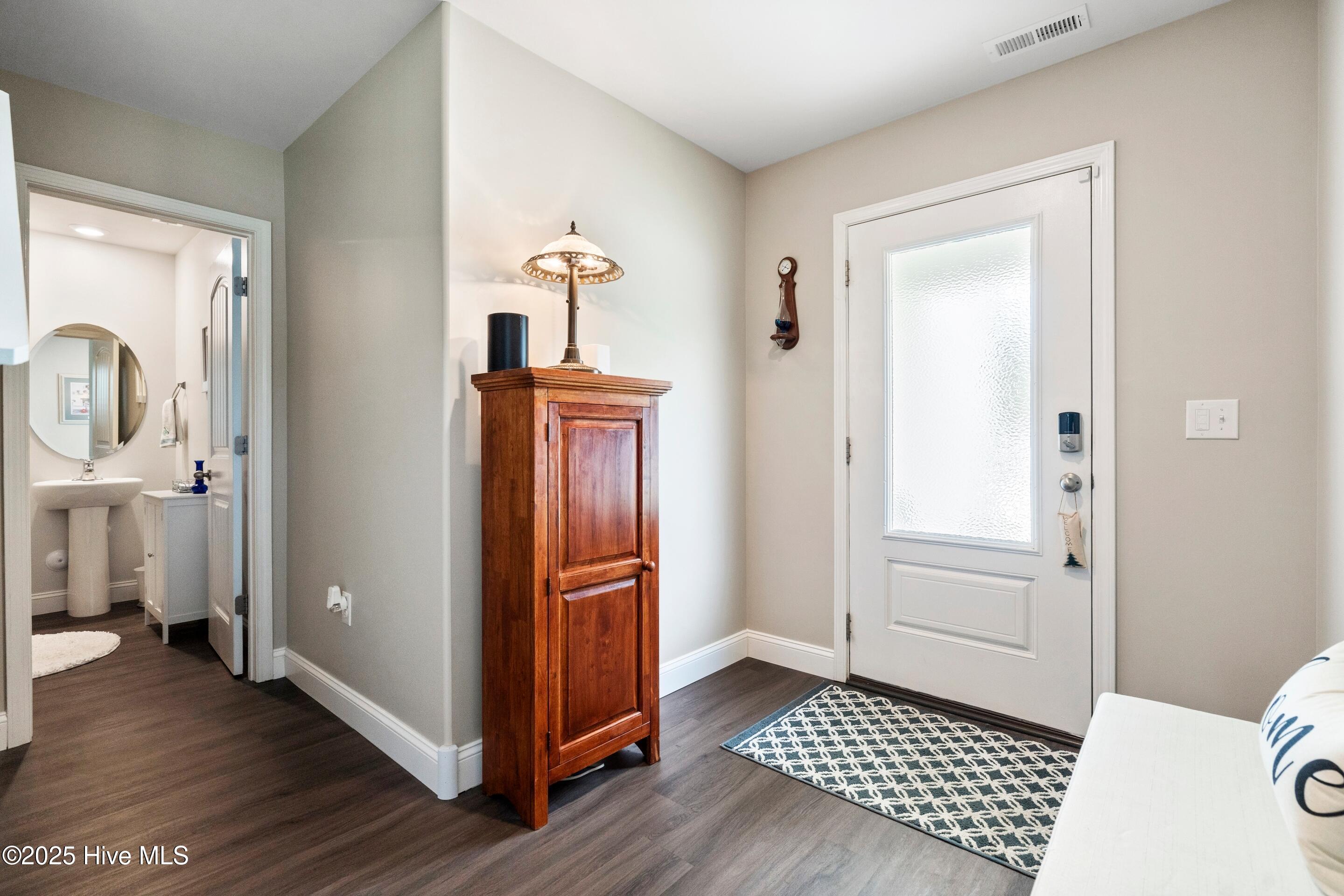 634 Aurora Place Hampstead, NC 28443 - Photo 7 of 51 Powder Room thoughtfully tucked away