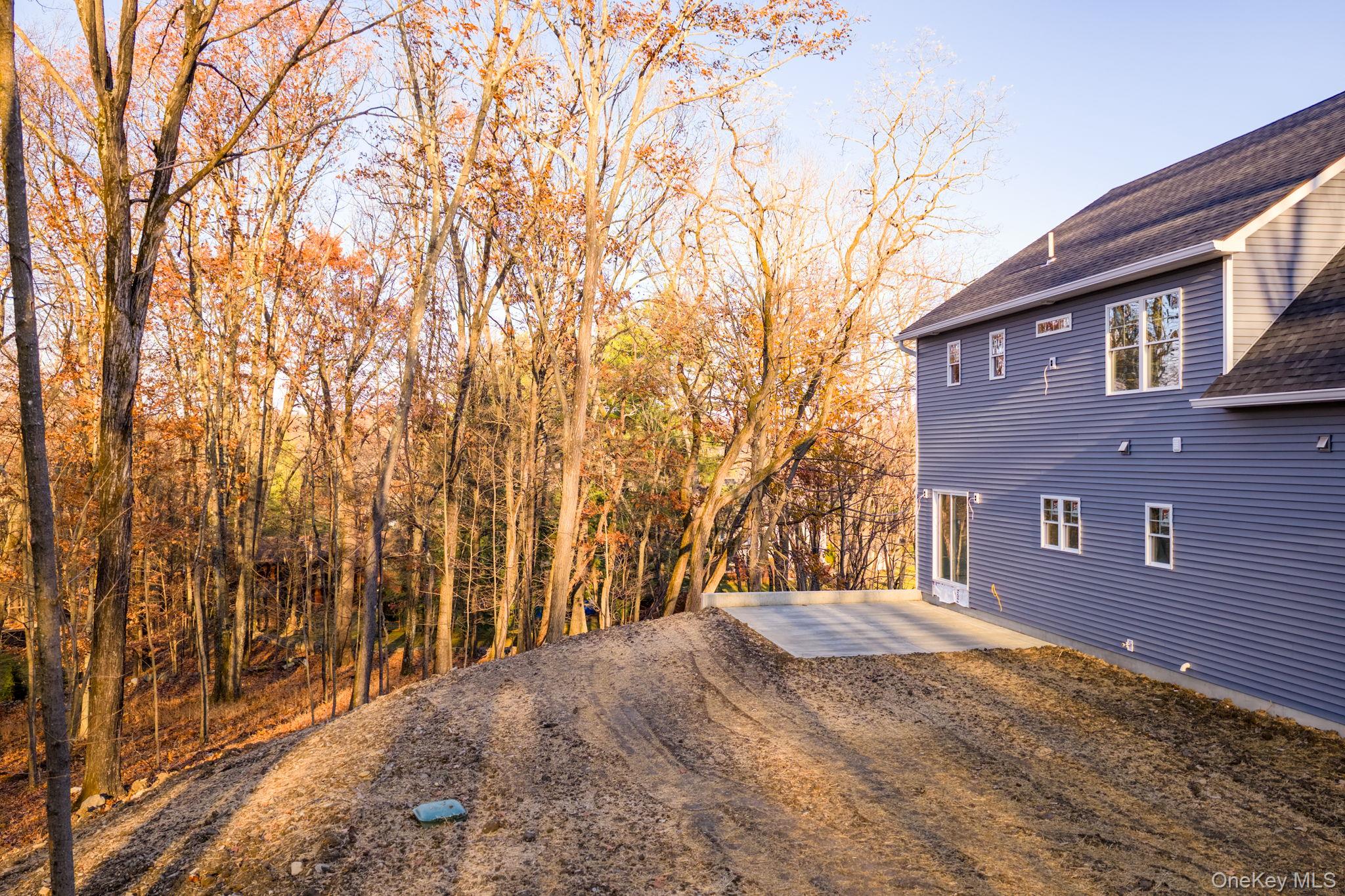 48 West Corbett Road Montgomery, NY 12549 - Photo 36 of 38 View of yard featuring a patio and a forest view