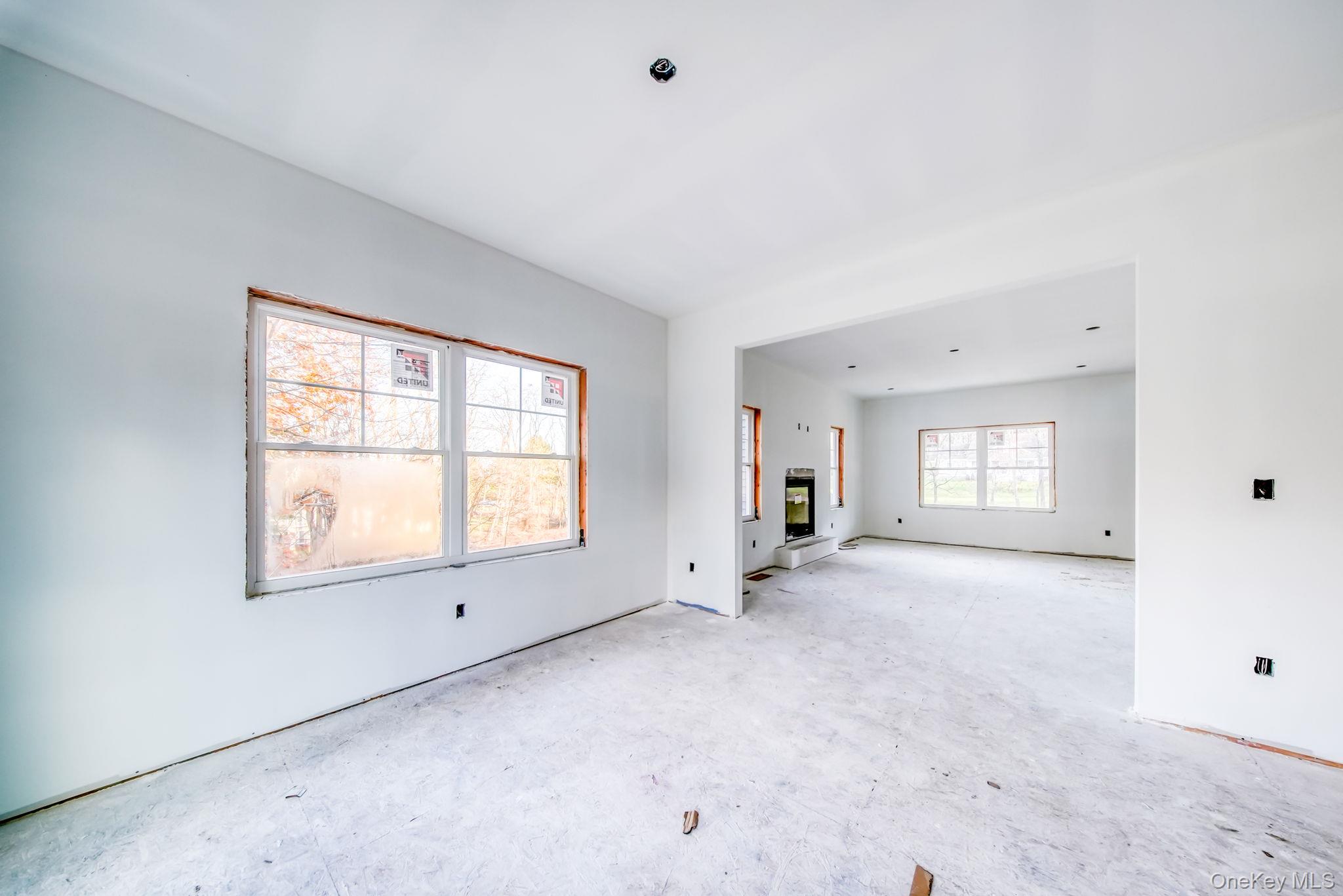 48 West Corbett Road Montgomery, NY 12549 - Photo 9 of 34 an empty room with a windows and ceiling fan