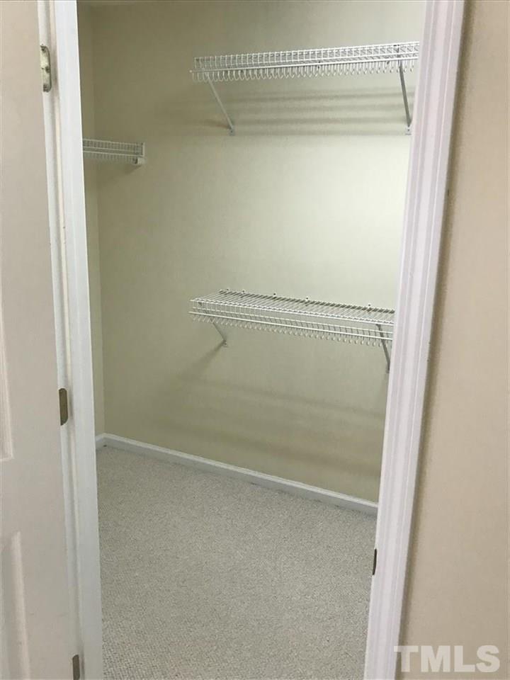 4528 Drewbridge Way Raleigh, NC 27604 - Photo 14 of 25 a bathroom with a glass shower door