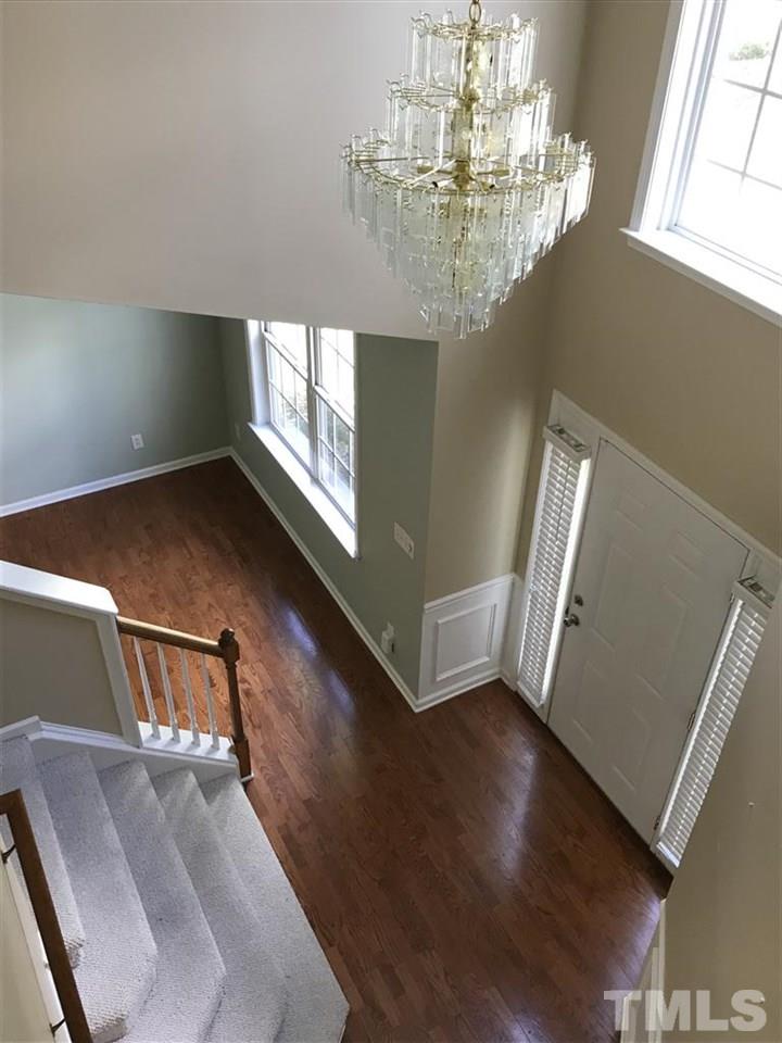 4528 Drewbridge Way Raleigh, NC 27604 - Photo 3 of 25 a view of entryway and hall with wooden floor
