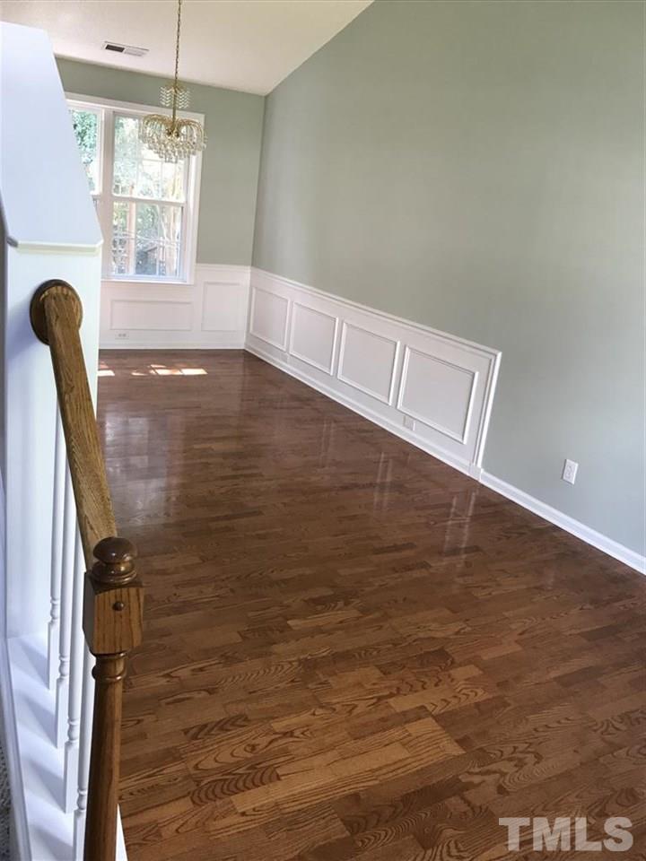 4528 Drewbridge Way Raleigh, NC 27604 - Photo 4 of 25 a view of a livingroom with wooden floor and a window