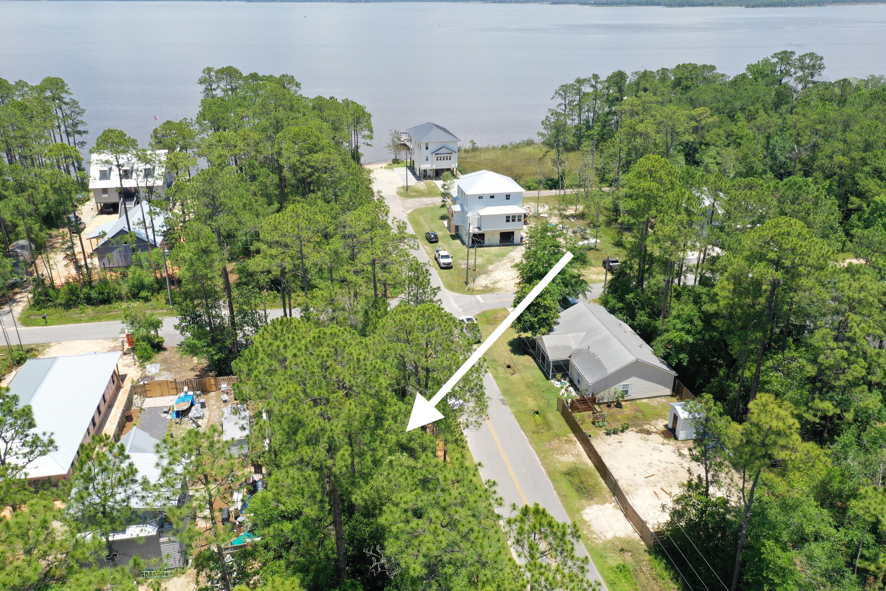 Lot 20 West Daisy Dr Point Santa Rosa Beach, FL 32459 - Photo 3 of 9 an aerial view of residential houses with outdoor space and trees