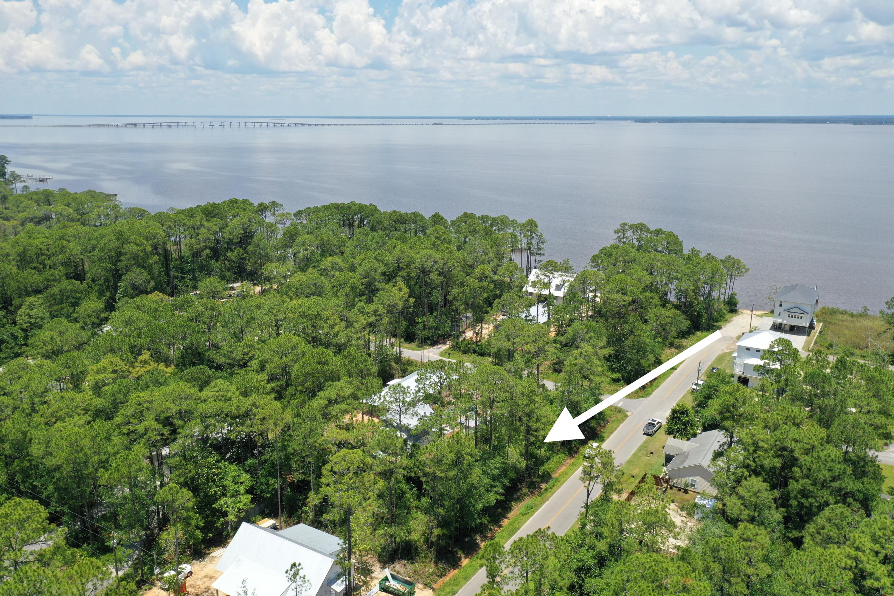 Lot 20 West Daisy Dr Point Santa Rosa Beach, FL 32459 - Photo 8 of 9 a backyard of a house with lots of green space