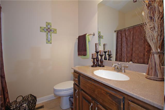 259 Aplin Branch Road Cottontown, TN 37048 - Photo 14 of 19 a bathroom with a sink vanity granite and toilet