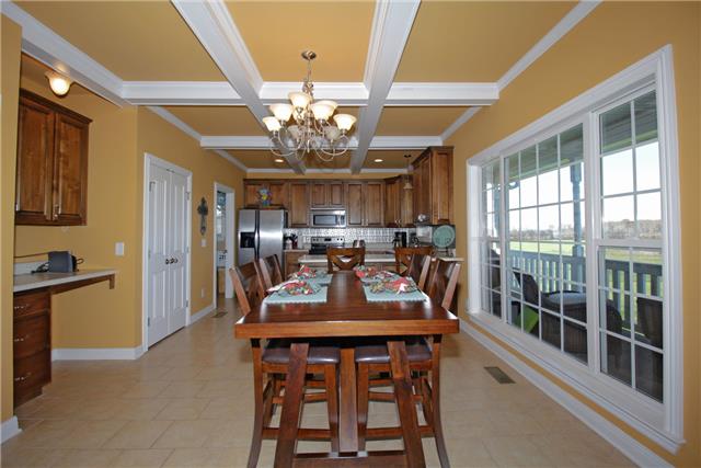 259 Aplin Branch Road Cottontown, TN 37048 - Photo 4 of 19 a view of a dining room with furniture a chandelier and large window