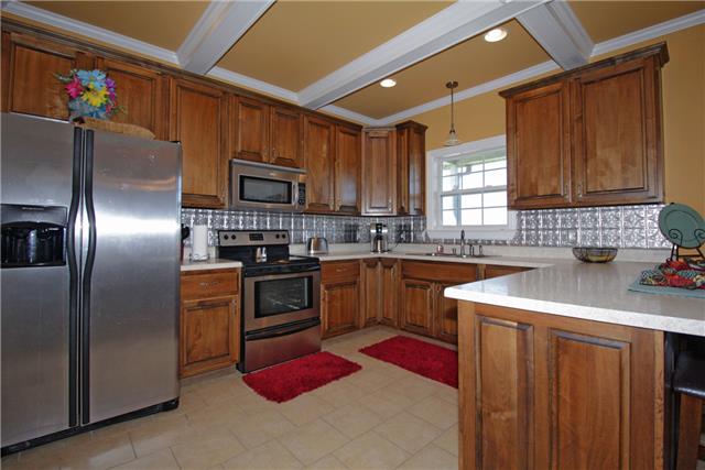 259 Aplin Branch Road Cottontown, TN 37048 - Photo 6 of 19 a kitchen with granite countertop a sink stainless steel appliances and counter space