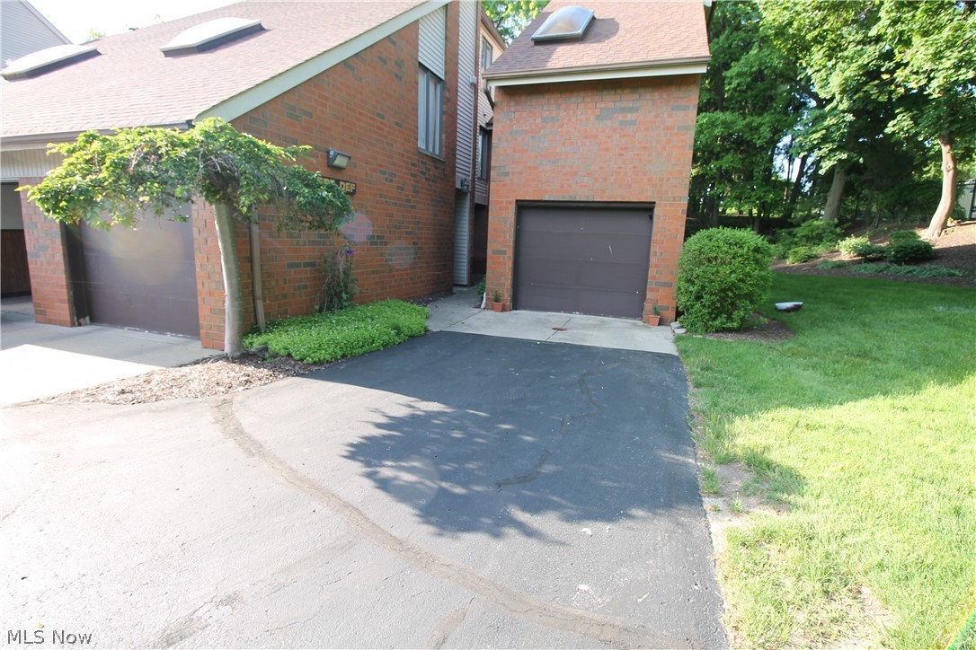 4695 Mayfield Road, Unit D South Euclid, OH 44121 - Photo 1 of 22 Entry from last bank of garages on the right