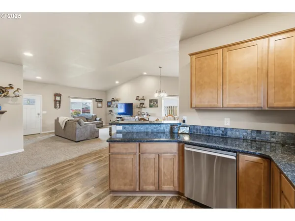 a kitchen with sink and cabinets