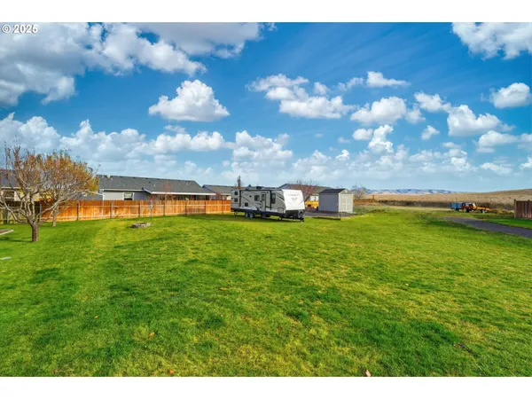 a view of a house with a big yard
