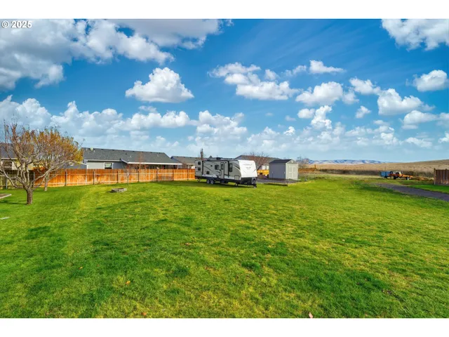 a view of a house with a big yard