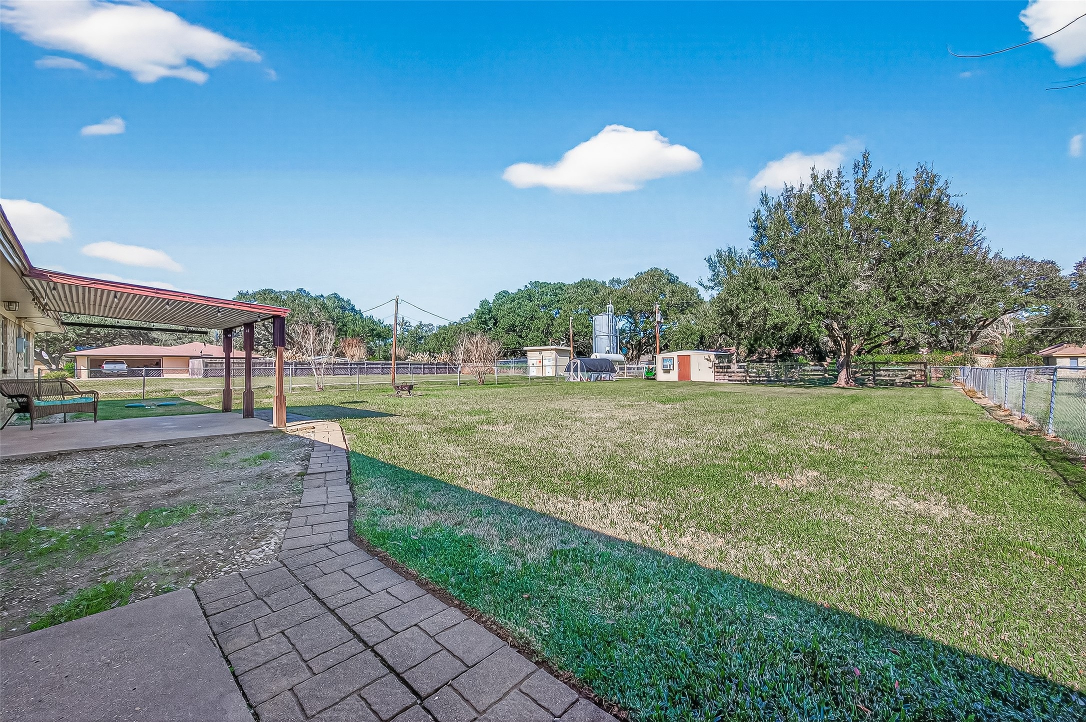 302 Jay Street Boling, TX 77420 - Photo 20 of 21 a view of a house with a big yard