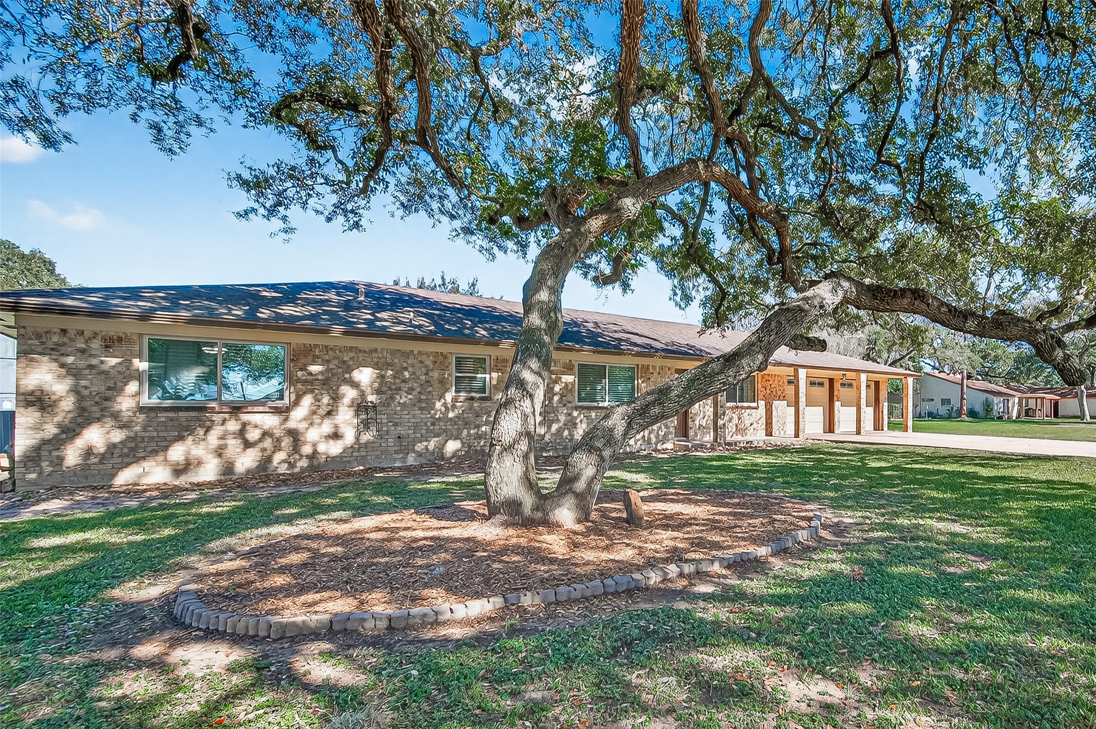 302 Jay Street Boling, TX 77420 - Photo 2 of 21 a front view of a house with garden