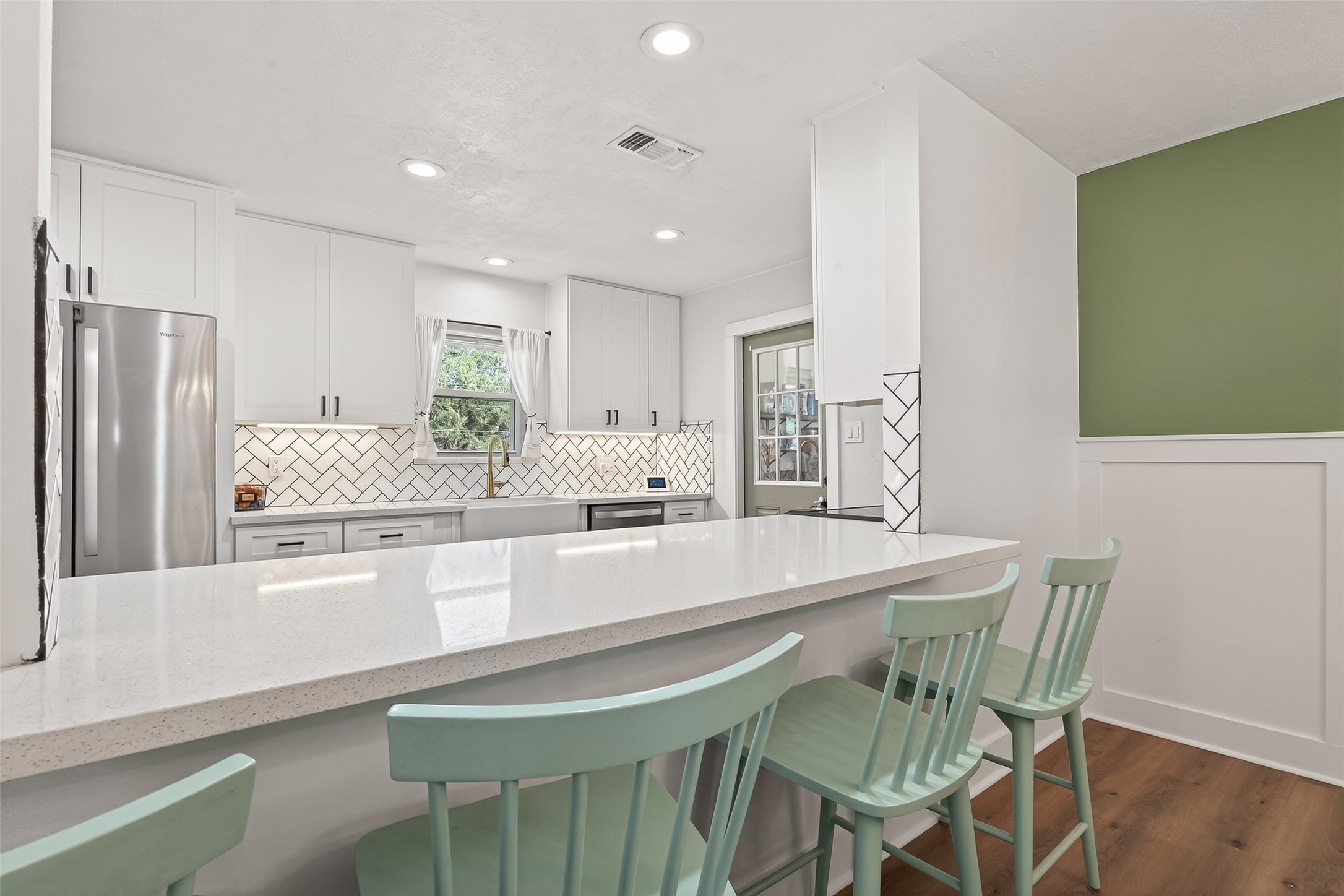 302 Jay Street Boling, TX 77420 - Photo 9 of 21 a kitchen with stainless steel appliances granite countertop a table chairs sink and cabinets