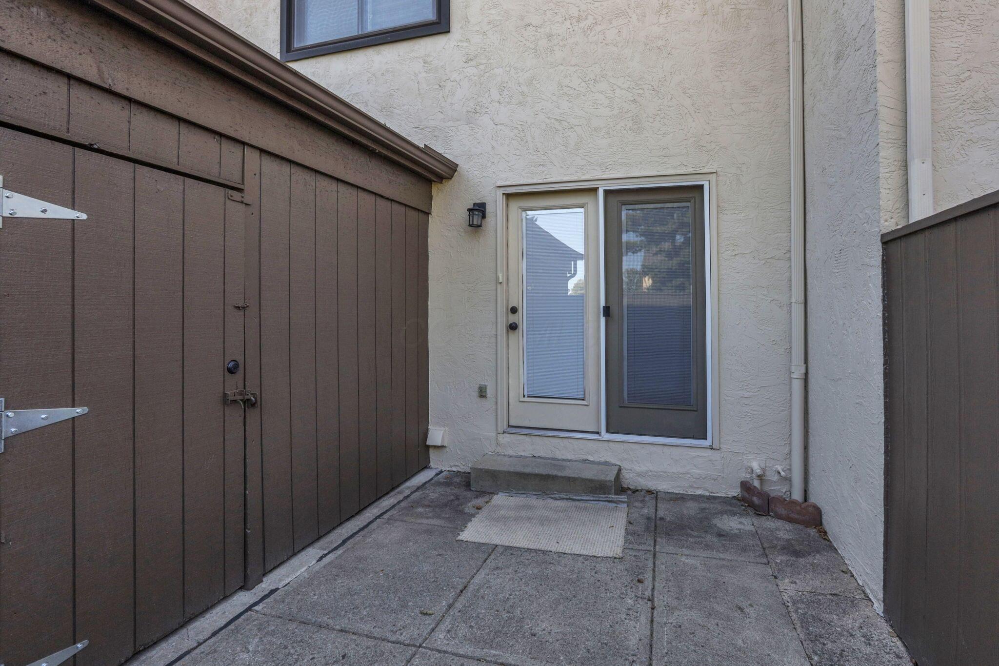 5283 Ruthton Road, Unit 19 Columbus, OH 43220 - Photo 25 of 26 Private Patio and Entrance to Carport