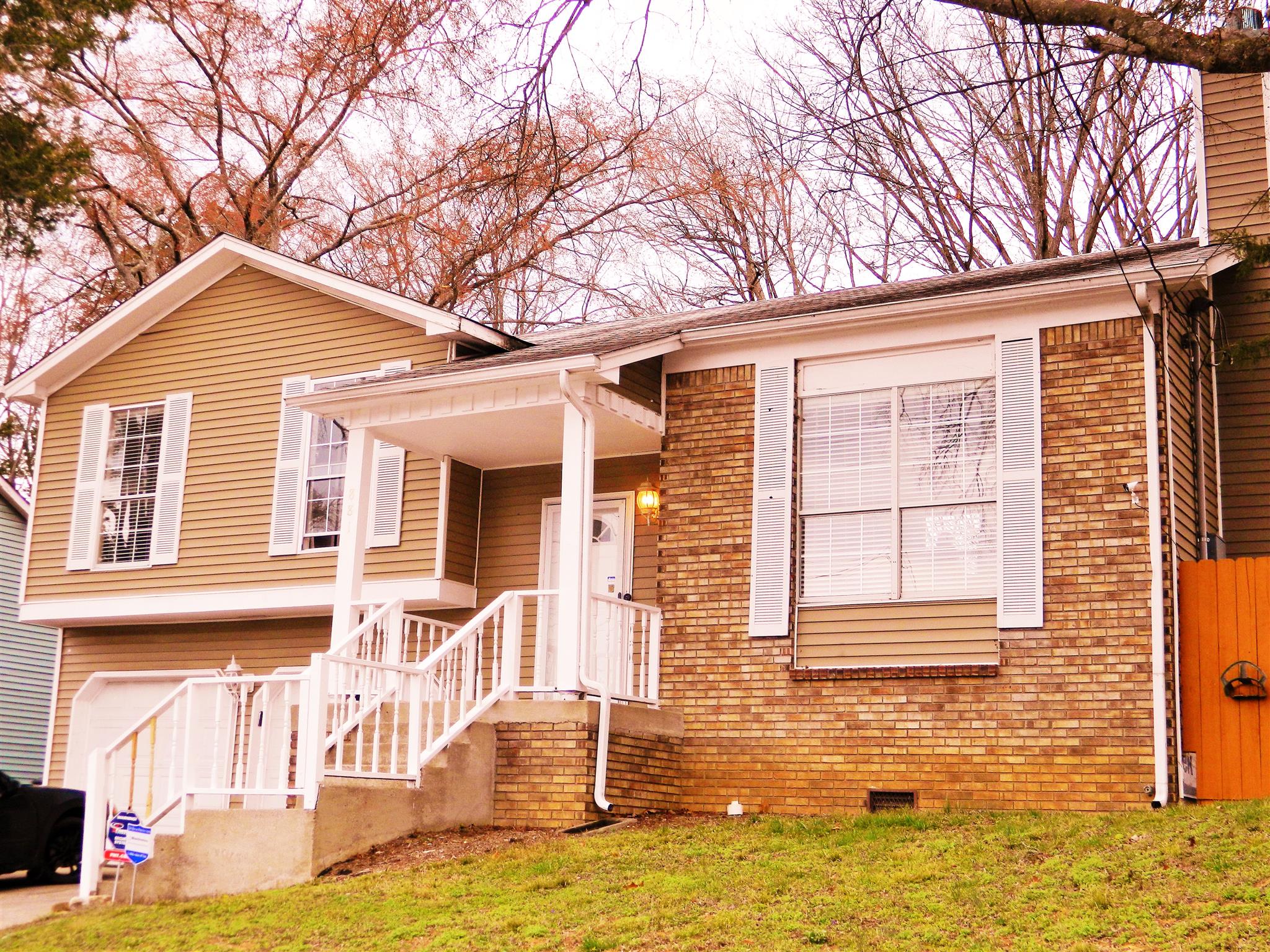 881 Bishopsgate Road Antioch, TN 37013 - Photo 1 of 19 a front view of a house with a yard