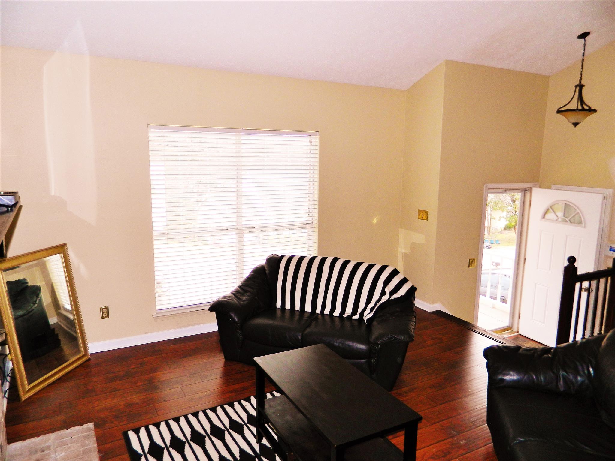 881 Bishopsgate Road Antioch, TN 37013 - Photo 3 of 19 a view of a bedroom with furniture wooden floor and window