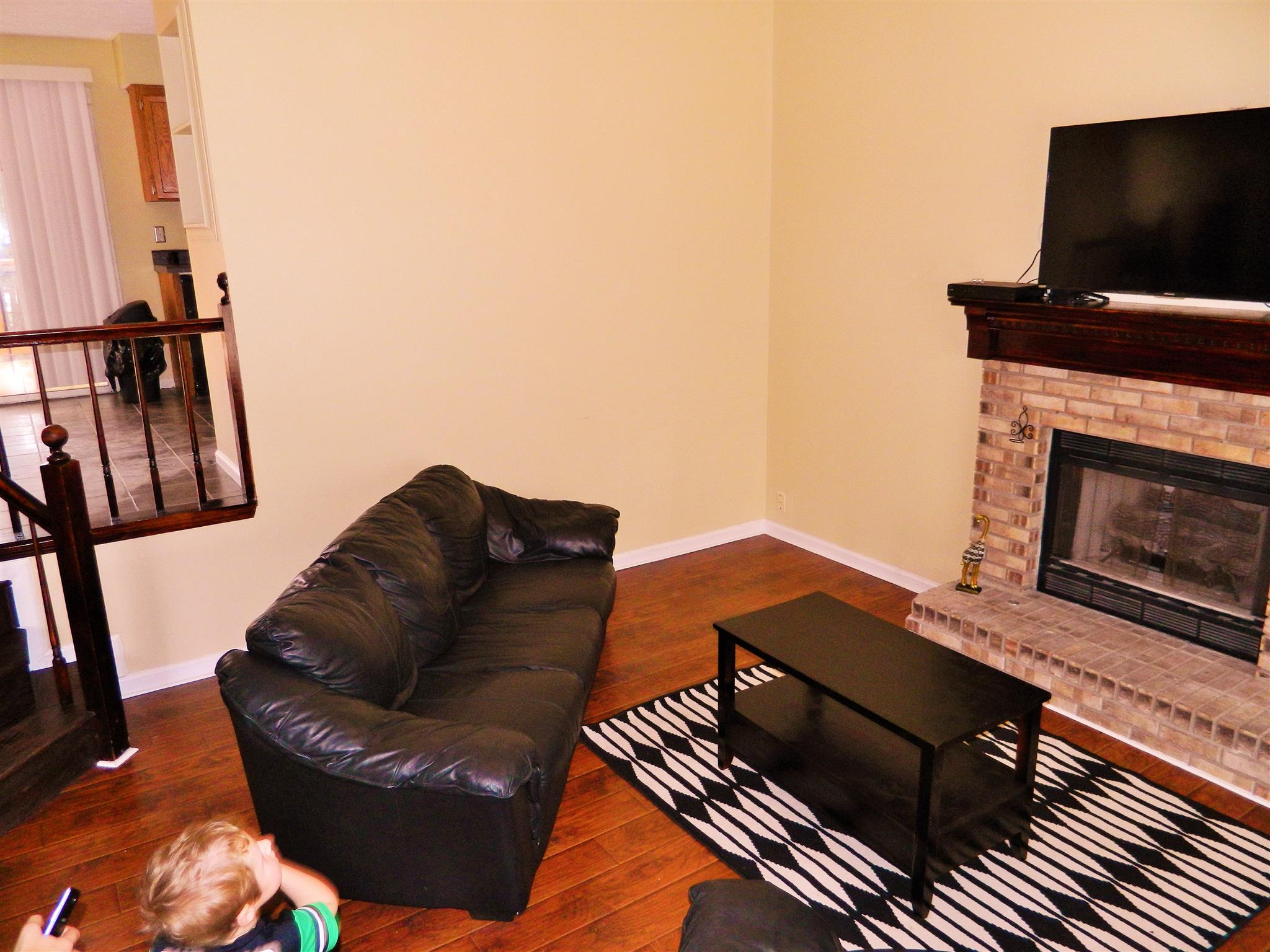 881 Bishopsgate Road Antioch, TN 37013 - Photo 4 of 19 a living room with furniture and a fireplace