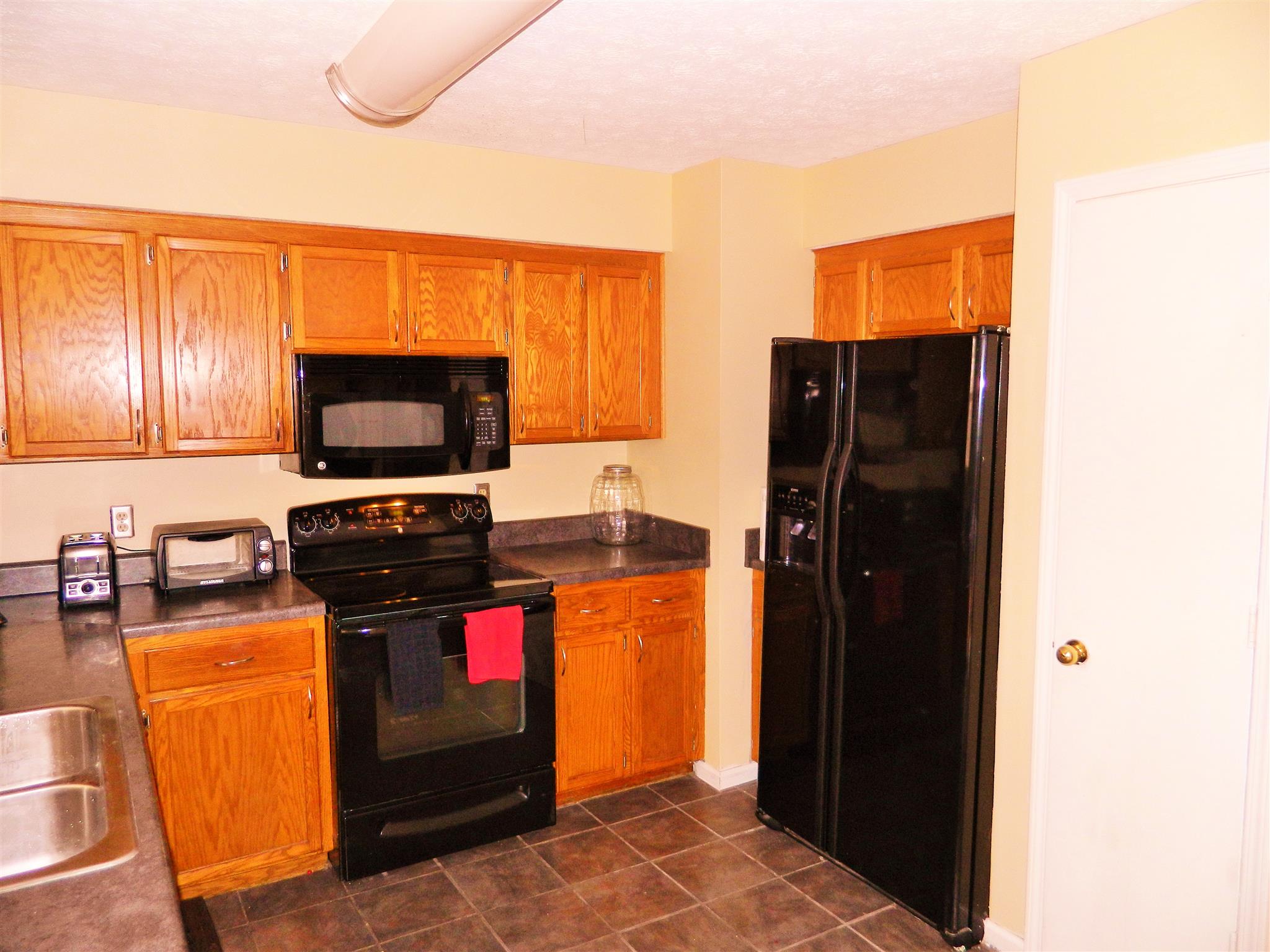 881 Bishopsgate Road Antioch, TN 37013 - Photo 5 of 19 a kitchen with stainless steel appliances a refrigerator and a microwave