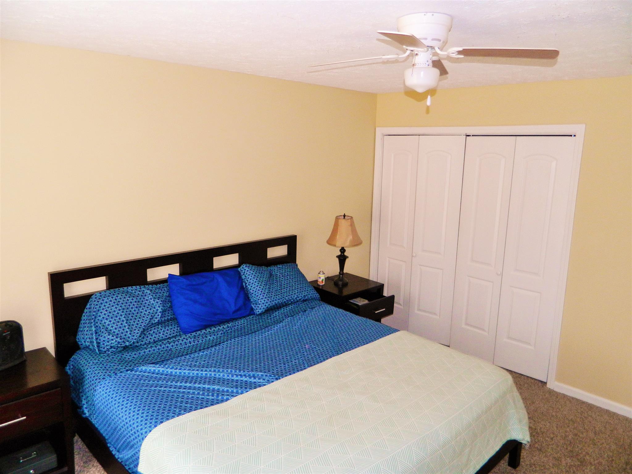 881 Bishopsgate Road Antioch, TN 37013 - Photo 8 of 19 a bedroom with a bed and a chandelier