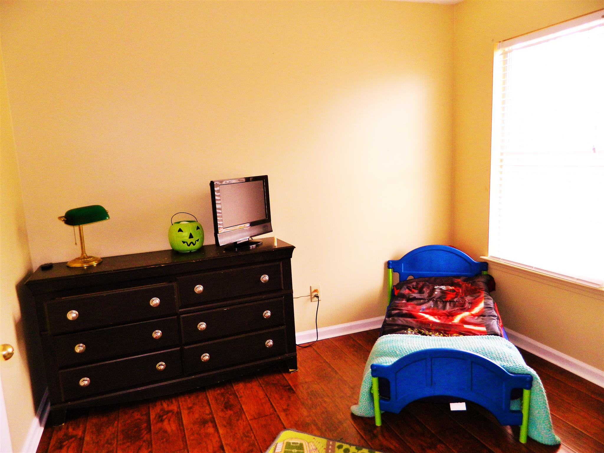 881 Bishopsgate Road Antioch, TN 37013 - Photo 10 of 19 a room with a bed and a lamp on dresser