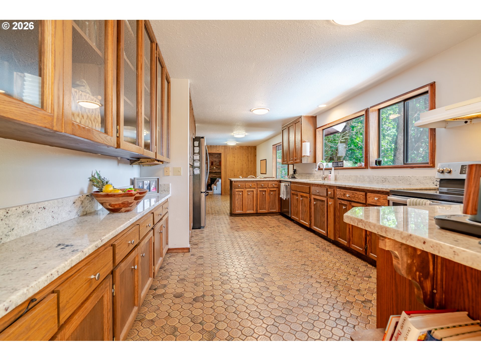 1622 Northwest Ribier Place Corvallis, OR 97330 - Photo 13 of 48 a kitchen with stainless steel appliances granite countertop a refrigerator and a sink