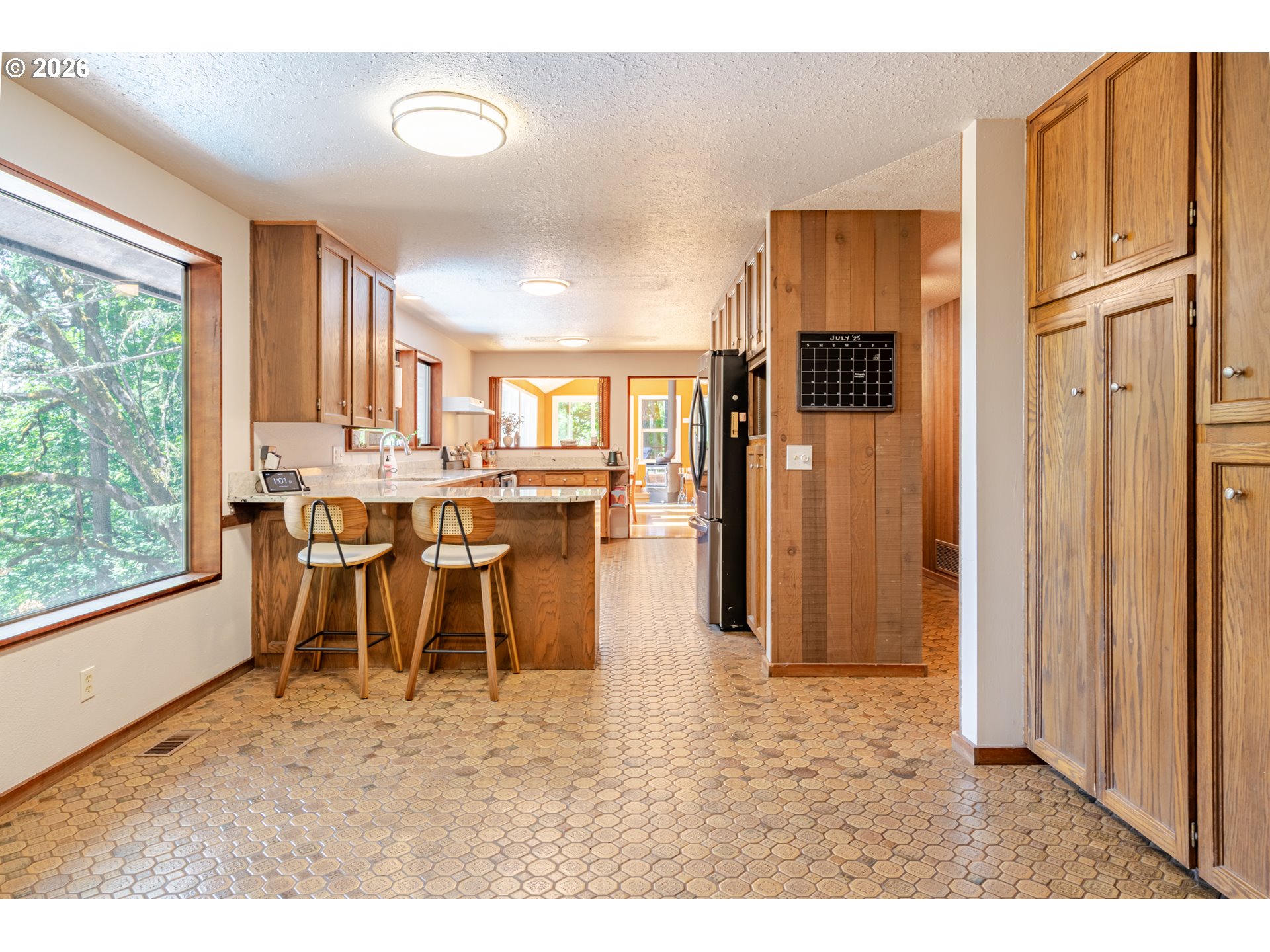 1622 Northwest Ribier Place Corvallis, OR 97330 - Photo 15 of 48 a dining area with stainless steel appliances granite countertop a refrigerator and a stove top oven
