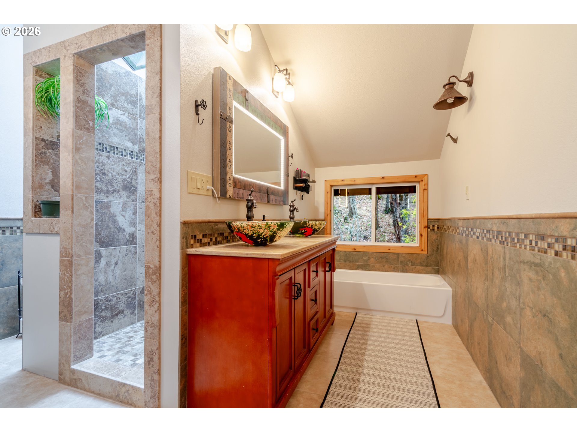 1622 Northwest Ribier Place Corvallis, OR 97330 - Photo 25 of 48 a bathroom with a sink a mirror and a bathtub