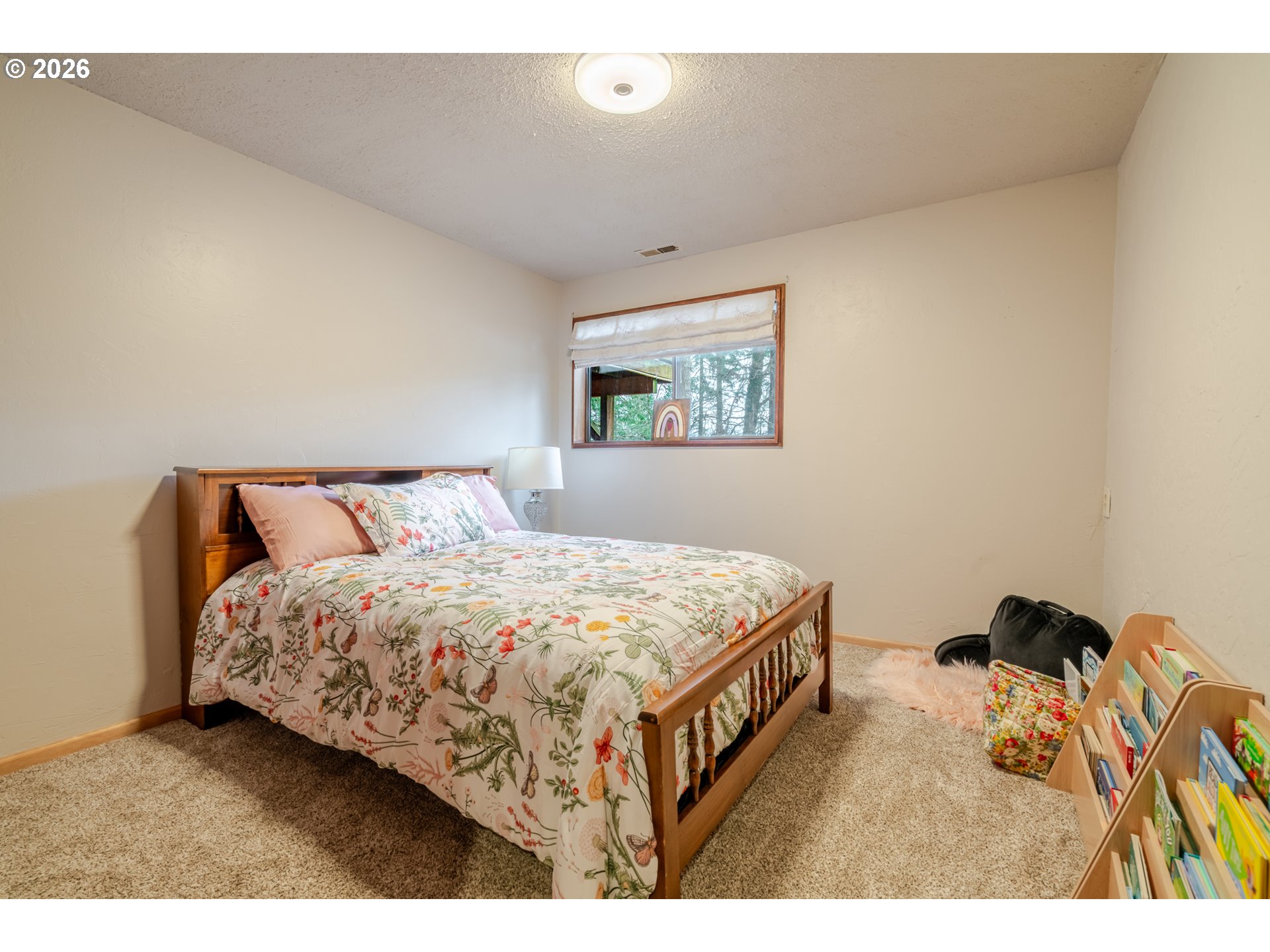 1622 Northwest Ribier Place Corvallis, OR 97330 - Photo 30 of 48 a bedroom with a bed and a tv