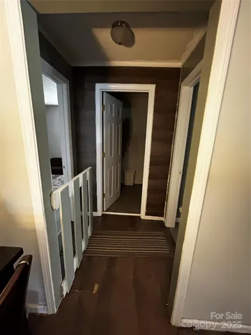 a bedroom with furniture and a wooden floor