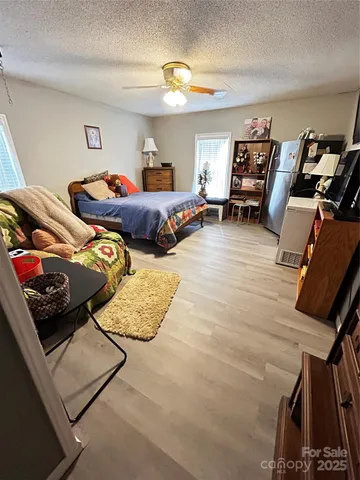 a bed room with a bed window and dresser