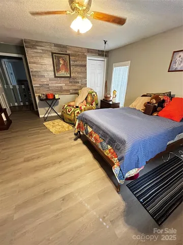 a bedroom with bed and window