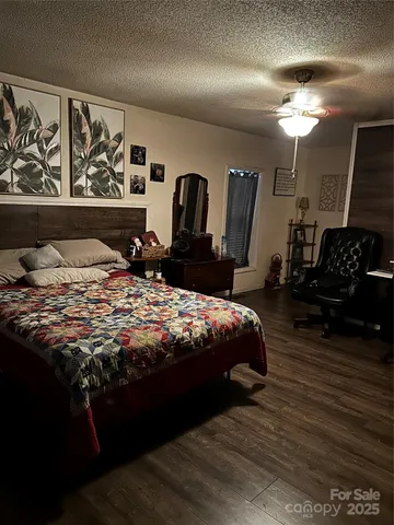a bedroom with a bed and dresser