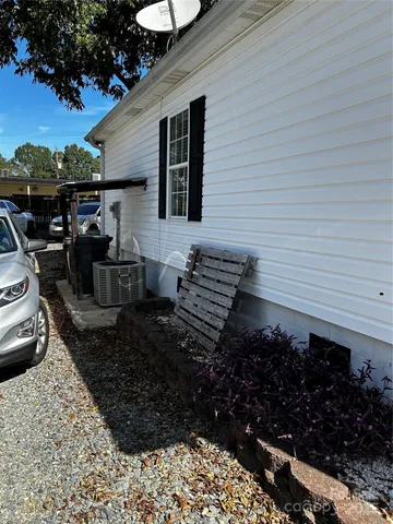 a view of a backyard with sitting area