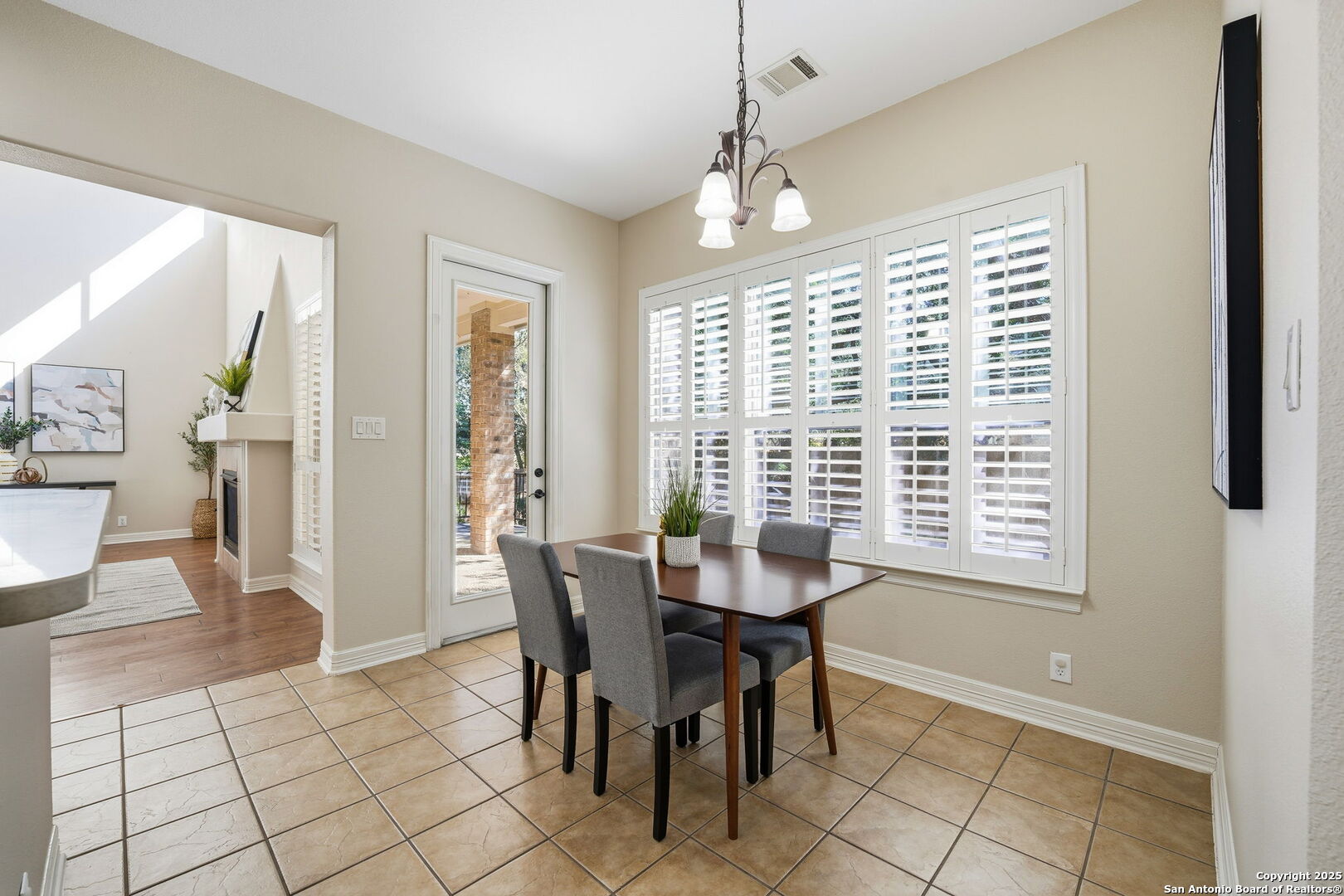 410 Heather Ridge San Antonio, TX 78260 - Photo 17 of 43 a view of a dining room with furniture and chandelier